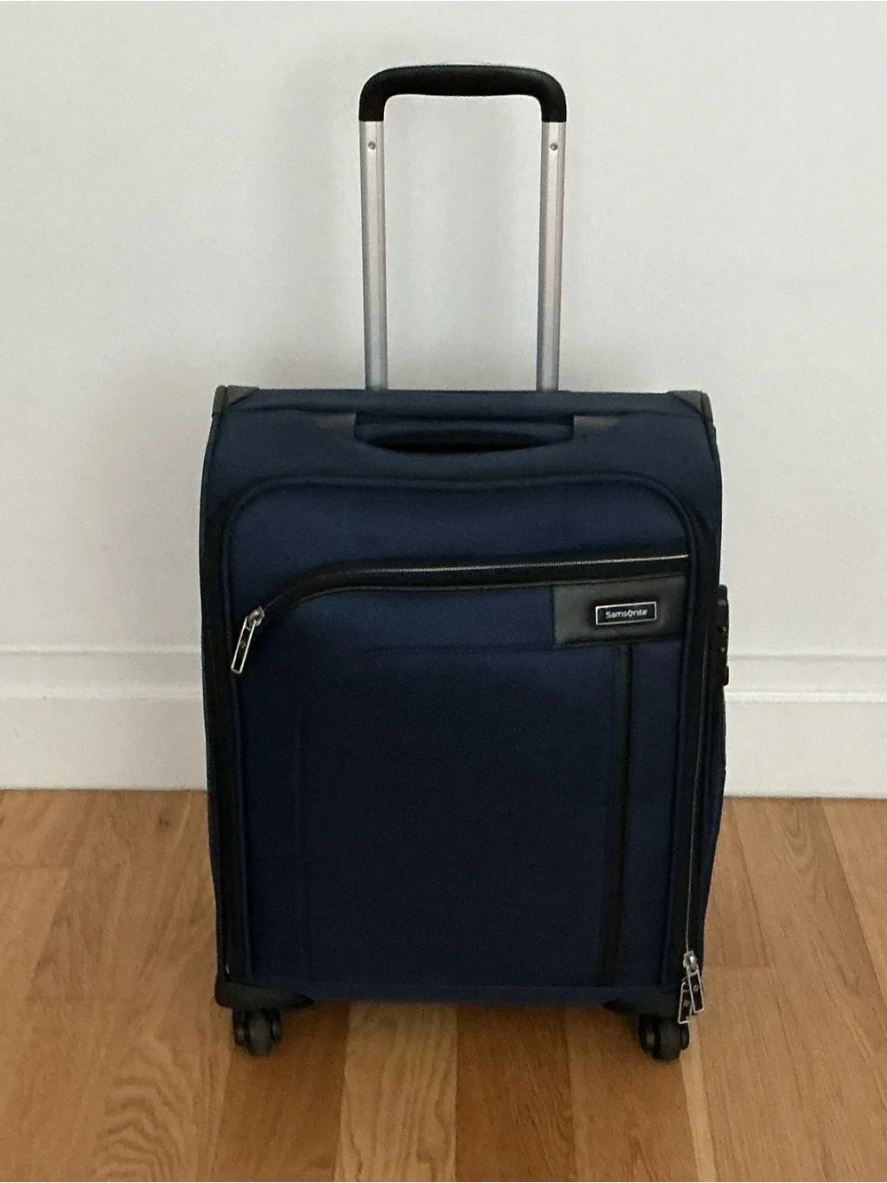 Samsonite Optimum softside spinner carry-on suitcase.